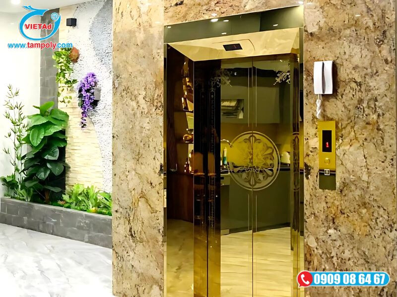 Inox vàng gương hoa văn ốp cửa thang máy